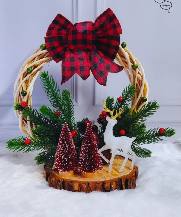 Christmas table top setup with reindeer and pine trees